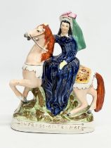 A rare mid 19th century ‘Empress of France’ Staffordshire figurine. 20x24cm