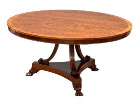 A large Regency style mahogany pedestal dining table with rosewood cross banding and paw feet. 152cm