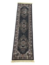 A large Middle Eastern style runner rug. 79x316cm