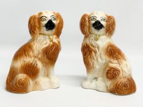 A pair of late 19th century Staffordshire Pottery dogs. 14x19cm