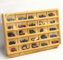 A collection of MatchBox Yesteryear model cars in display.