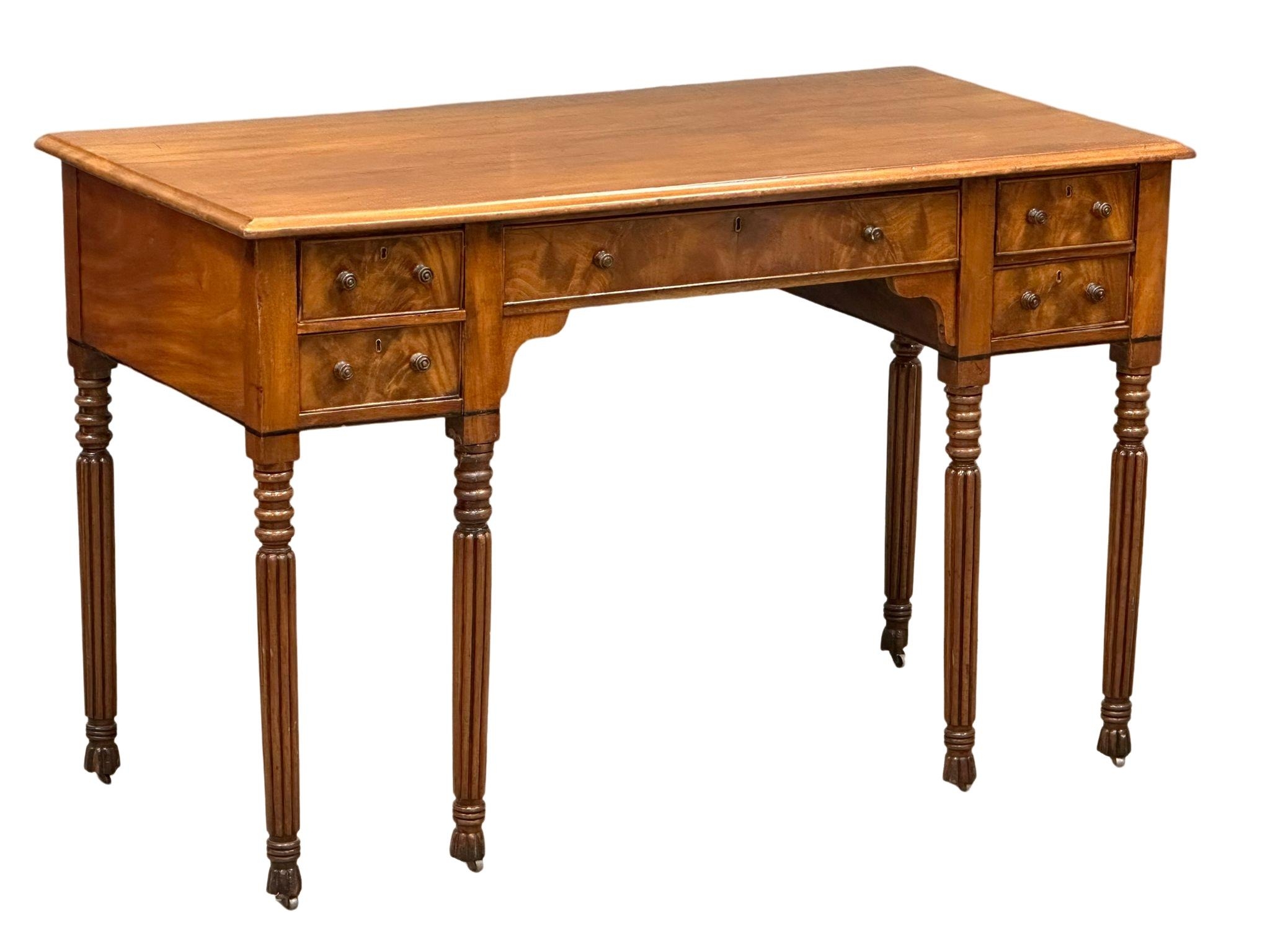 A late George IV mahogany side table/desk on reeded legs. 126cm x 61cm x 80cm - Image 4 of 9