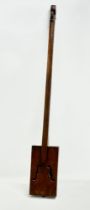 An early 20th century handmade one string fiddle/guitar. 89cm