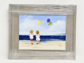 An oil painting on board by Michelle Carlin. Balloons on the Beach. 39.5x29.5cm. Frame 56x46cm