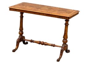A Victorian walnut library table/side table on carved cabriole legs with stretcher support. Circa