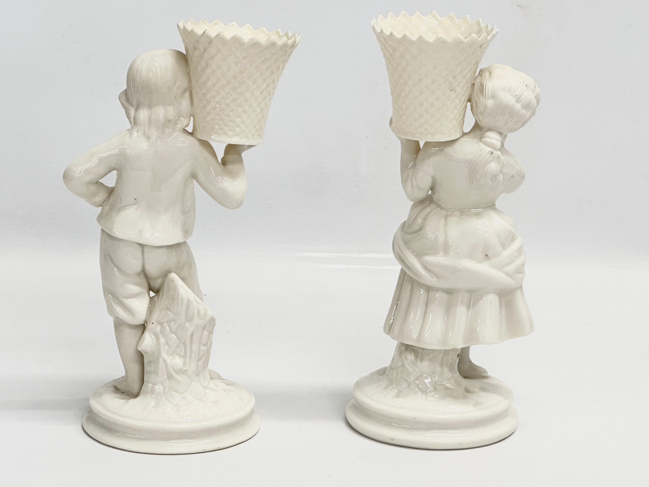 A pair of Belleek Pottery ‘Basket Carrier’ figurines. Girl basket Bearer, Boy Basket Bearer. 21.5cm - Image 4 of 5