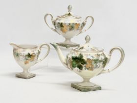 A 3 piece R.S. Prussia porcelain tea service. Decorated with embossed gilt flowers and autumn