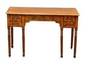 A late George IV mahogany side table/desk on reeded legs. 126cm x 61cm x 80cm