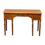 A late George IV mahogany side table/desk on reeded legs. 126cm x 61cm x 80cm