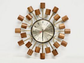 A 1960’s Mid Century teak ‘Sunburst’ clock by Smiths. 39cm