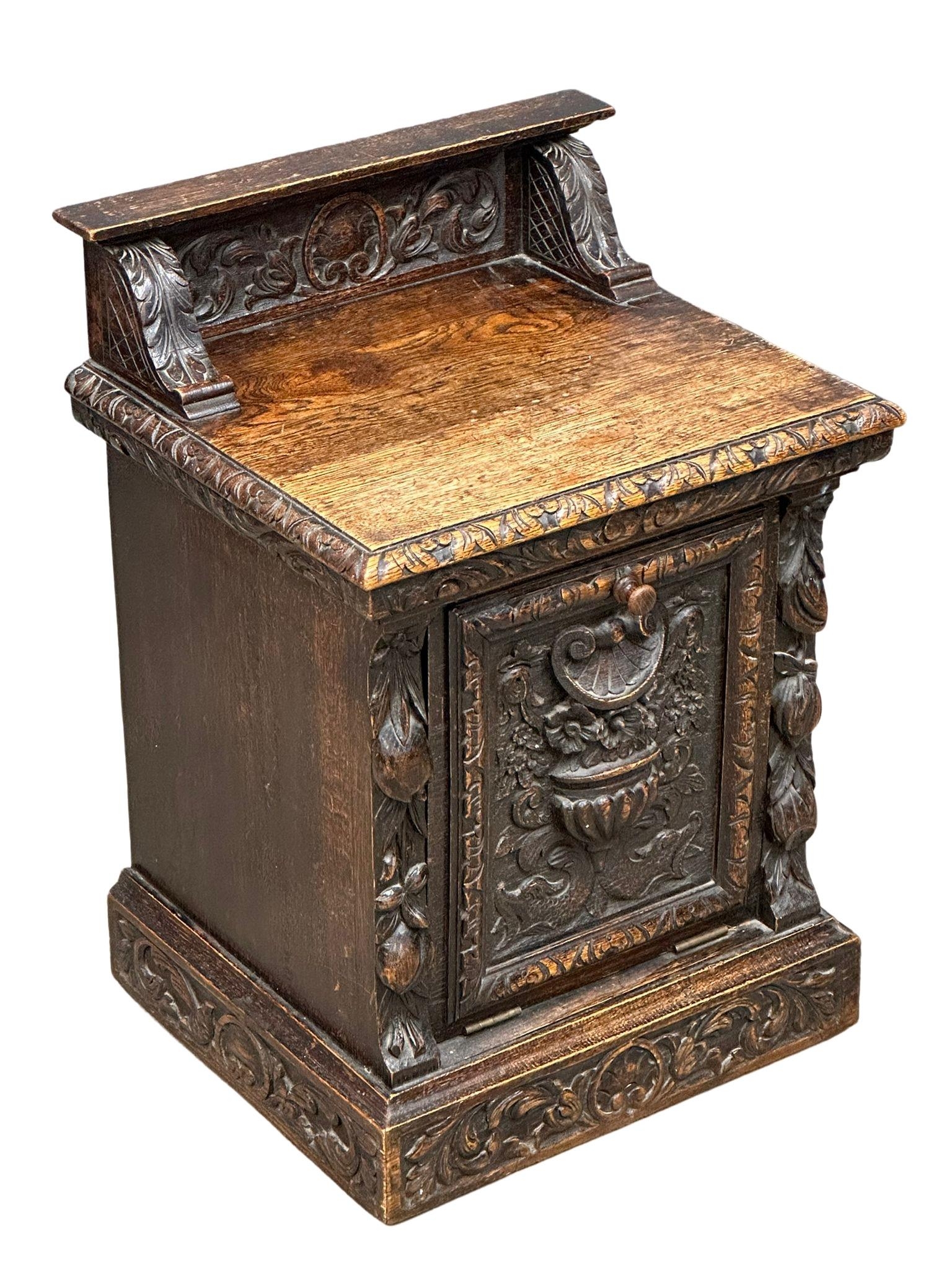 A Victorian carved oak purdonium/coal box. Circa 1870. 47cm x 41cm x 67cm - Image 6 of 7