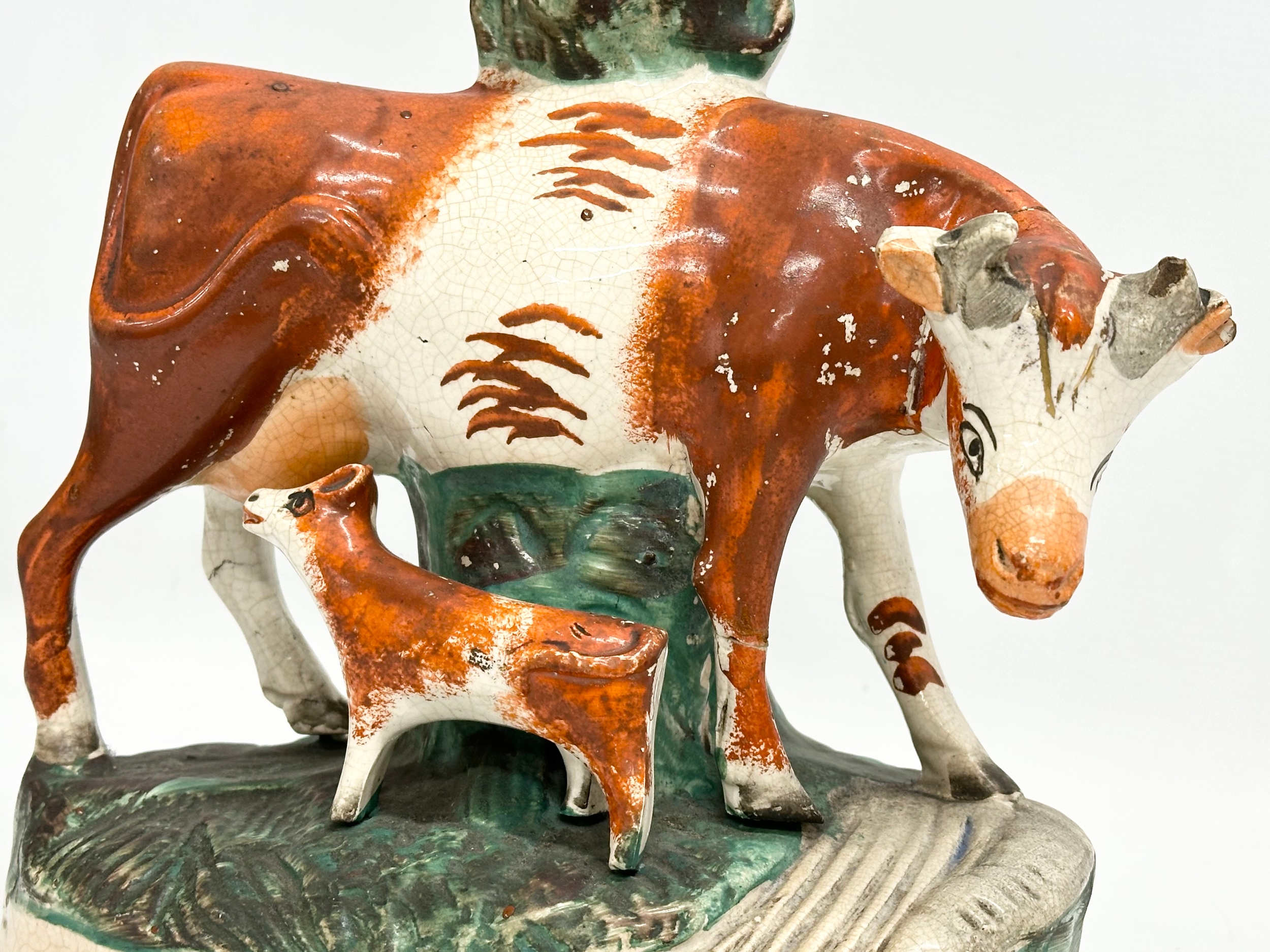 A pair of mid/late 19th century Staffordshire Cow spill vases. 22x27.5cm - Image 6 of 7