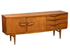 A 1960s Mid Century teak bow front sideboard by Beautility. 184cm x 48cm x 77cm