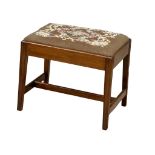 A late 19th century George III style mahogany footstool with tapestry top. Circa 1870-1890.