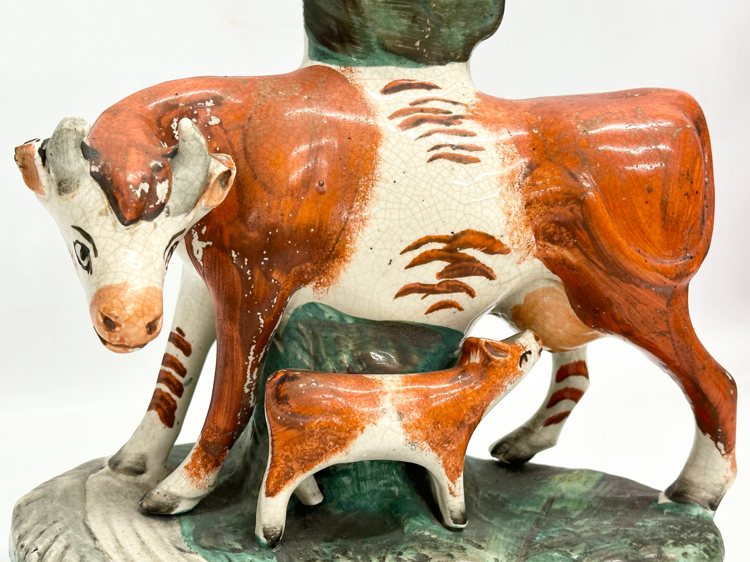 A pair of mid/late 19th century Staffordshire Cow spill vases. 22x27.5cm - Image 3 of 7