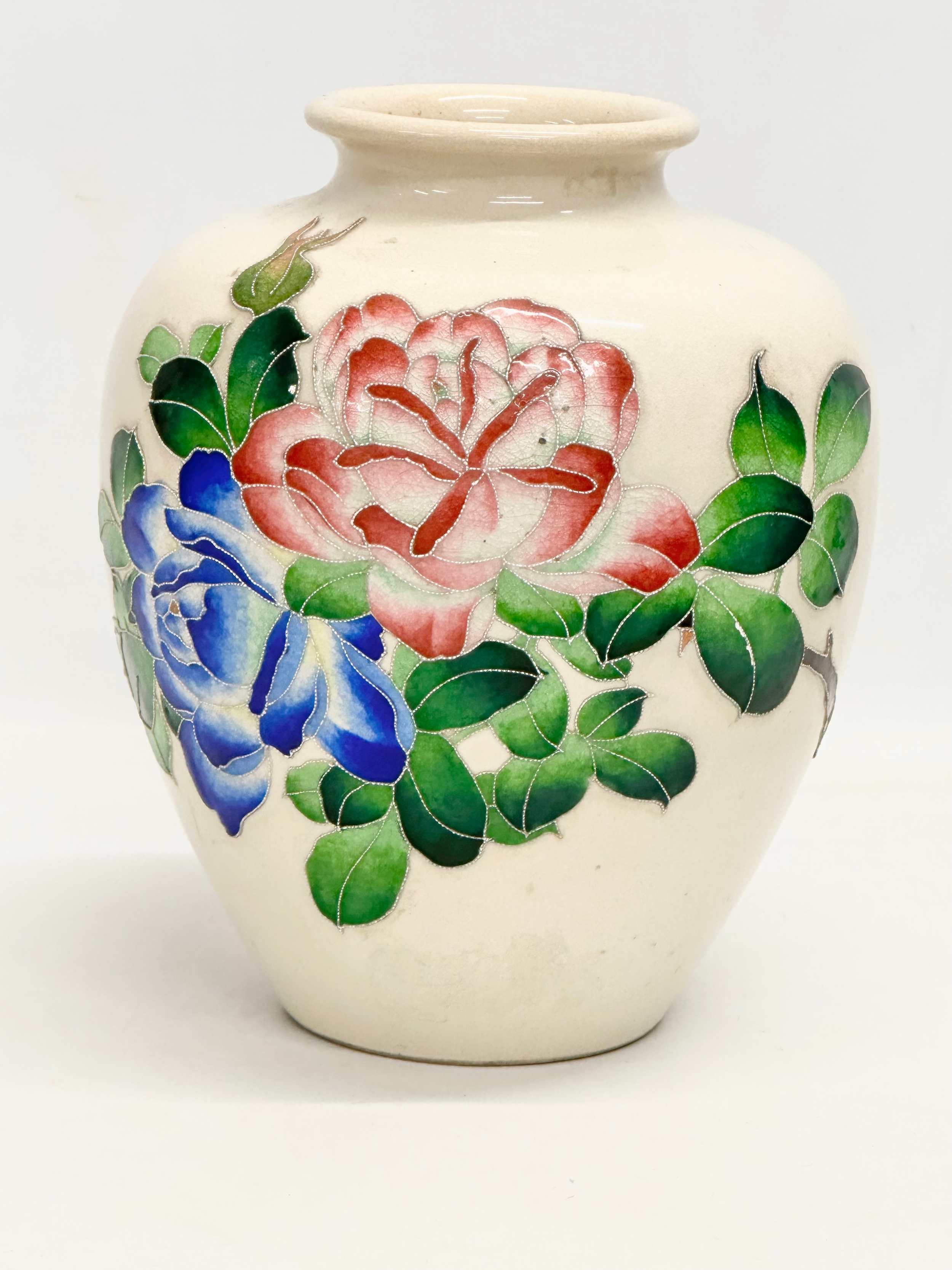 A large crackle glazed pottery vase with enamelled flower decoration. Early/Mid 20th century.