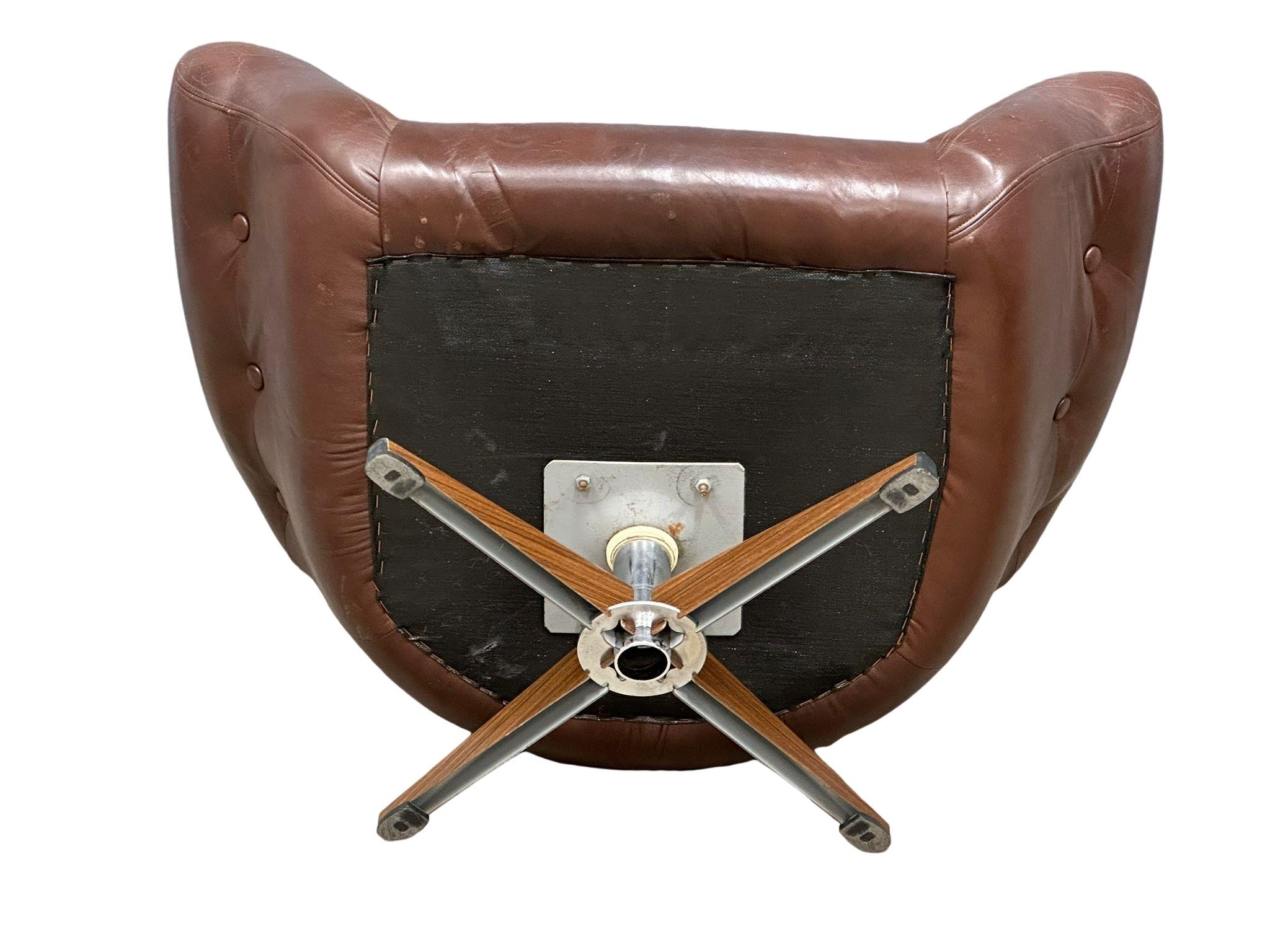 A Swedish Mid Century Gungan Slatte leather swivel chair on faux rosewood base.1 - Image 2 of 5
