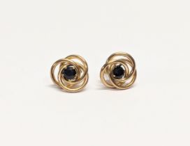 A pair of 9ct gold and sapphire earrings.