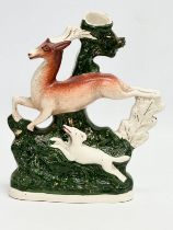 A rare mid 19th century Staffordshire Pottery Deer & Hound spill vase. 18x23cm