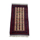 A vintage hand knotted Afghan rug. 104x210cm