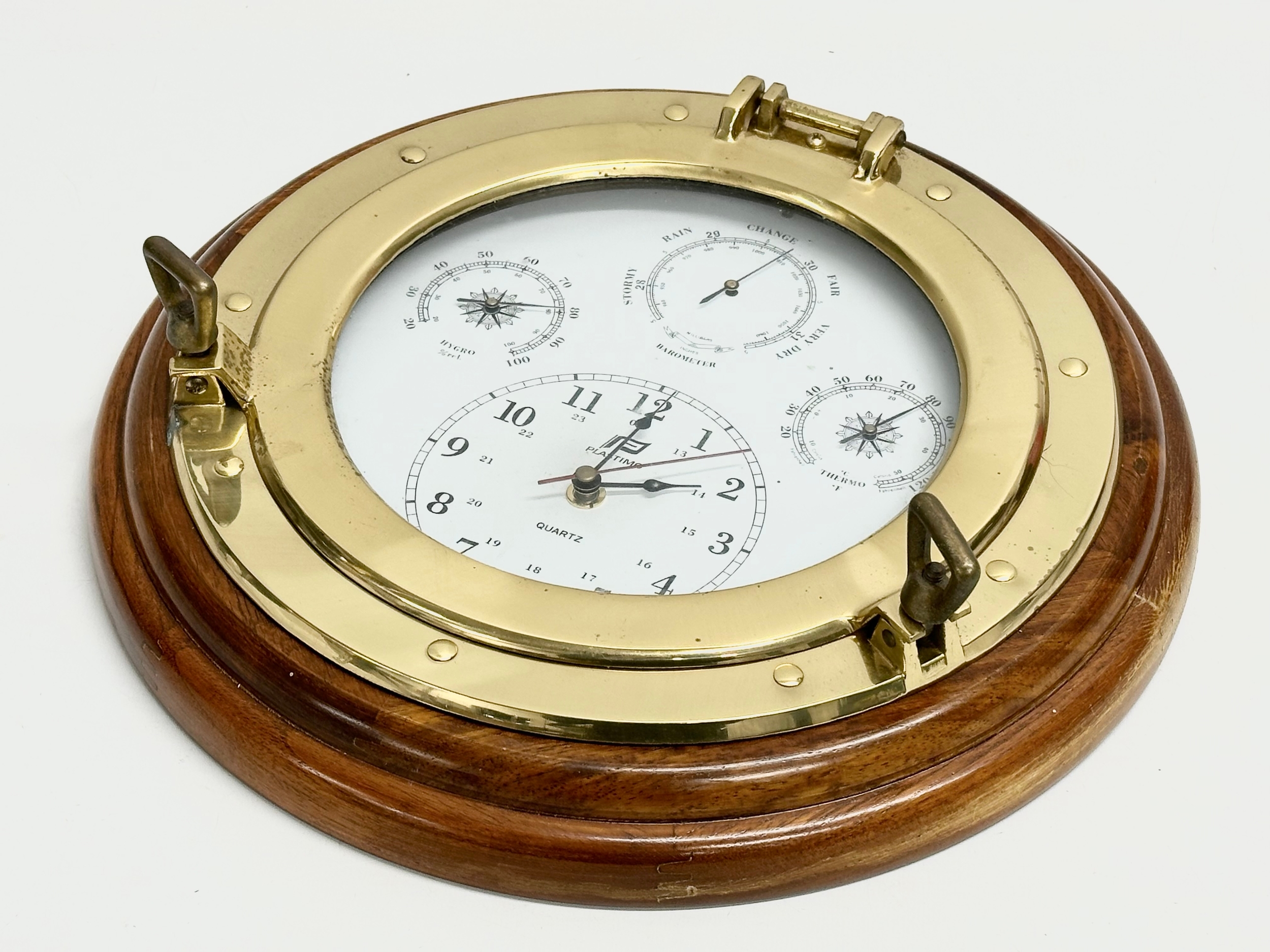 A Plastimo Porthole Weatherman barometer wall clock. 34.5cm