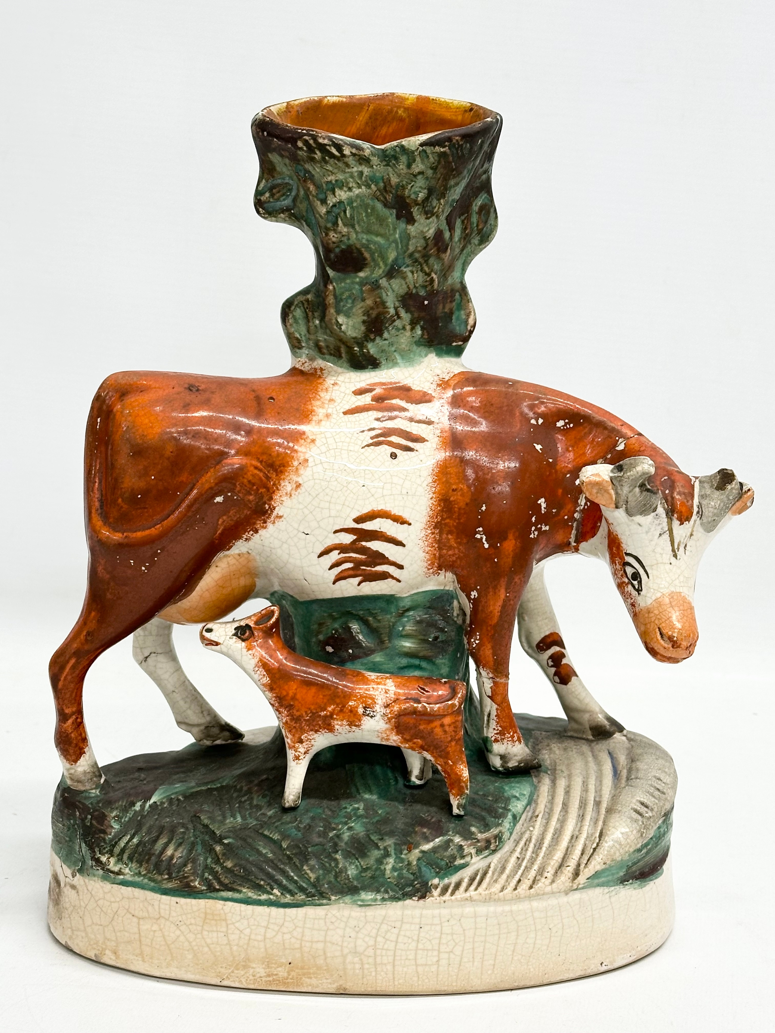 A pair of mid/late 19th century Staffordshire Cow spill vases. 22x27.5cm - Image 5 of 7