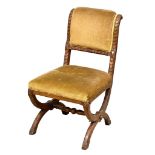 A Victorian oak framed x-framed chair.
