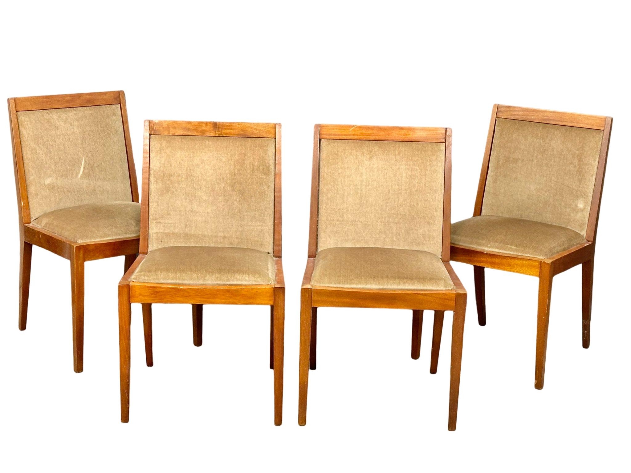 A set of 4 Mid Century teak dining chairs.(1)