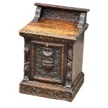 A Victorian carved oak purdonium/coal box. Circa 1870. 47cm x 41cm x 67cm