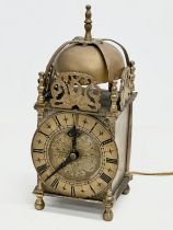 A vintage 17th century style English brass mantle clock by Smiths. 25cm