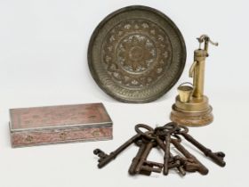 A job lot. A vintage Indian cigarette box, 19th century keys, a small vintage brass water pump