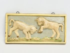 A late 19th/early 20th century hand painted ‘Lamb’ wall plaque. Circa 1900. 23x11cm