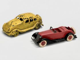 A vintage Tootsie Toys Open Sportscar, 1940’s. A 1930’s yellow tinplate car. 10cm