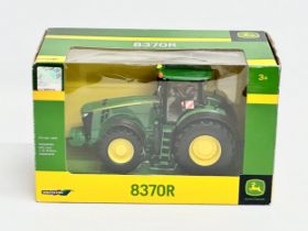 A Britains John Deere 837OR tractor in box. 25x13x16cm