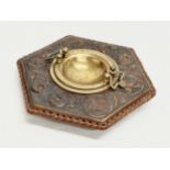 A late 19th century embossed leather bound ashtray with original brass liner. Depicting Don