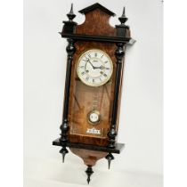 A good quality Victorian style Burr Walnut and mahogany Vienna wall clock by Astra. With key and pen