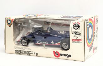 A Burago model Grand Prix racecar, Candy Tyrrell. 1/14 scale. Box measures 36x16cm