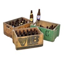 A collection of vintage beer bottles and crates. Guinness, Bass, Tennants, etc.