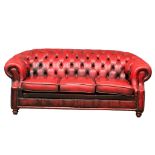 A deep buttoned ox-blood leather Victorian style 3 seater sofa. 207cm
