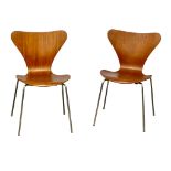 A pair of Danish Mid Century stacking dining chairs designed by Arne Jacobsen for Fritz Hansen,