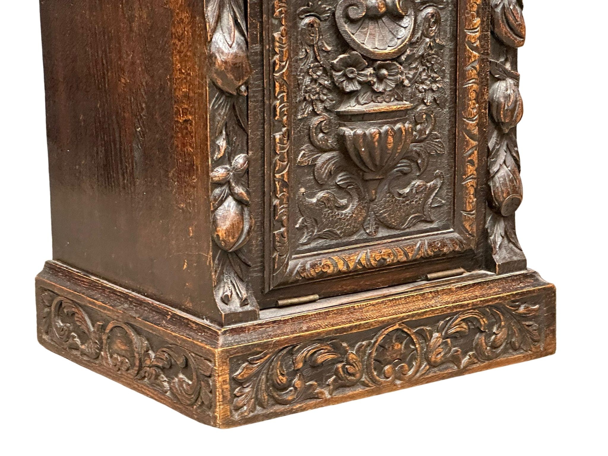 A Victorian carved oak purdonium/coal box. Circa 1870. 47cm x 41cm x 67cm - Image 3 of 7