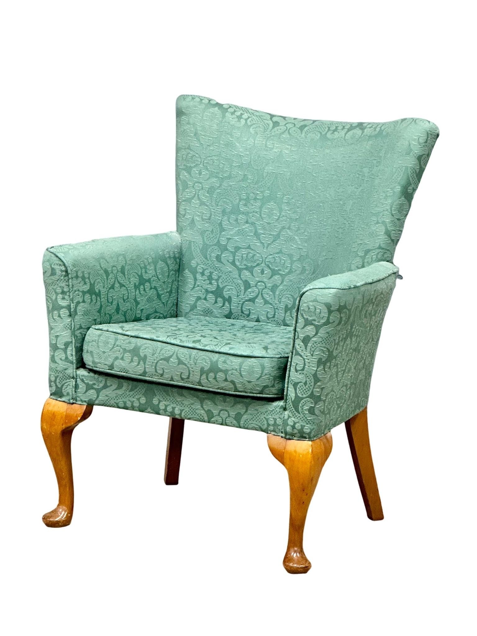 A mid 20th Century fire side armchair, 63cm x 47cm x 81cm