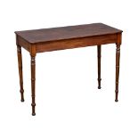 A George IV mahogany side table on reeded legs. Circa 1820. 96.5x43x79cm