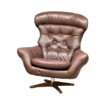 A Swedish Mid Century Gungan Slatte leather swivel chair on faux rosewood base.1
