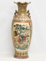 A very large Japanese style baluster pot with frilled rim, embossed painted figures and flowers.