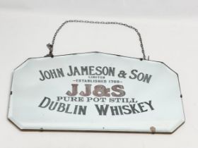 An early 20th century John Jameson & Son (JJ&S) Dublin Whiskey advertising mirror. 61x36cm