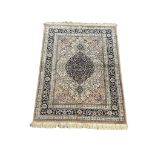 A Kashmir silk rug. 179x125cm