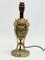 A good quality vintage French brass and onyx table lamp, decorated with rams head and draped