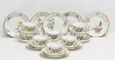 A Herend Hvngary hand painted 24 piece dinner service. Early 20th century. Soup bowls, saucers and