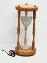 A large sand timer hourglass. 28x61cm